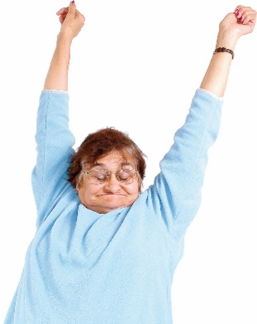 A woman with her eyes closed stretching both arms into the air