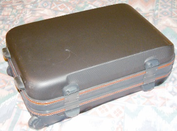 a packed suitcase on a bed
