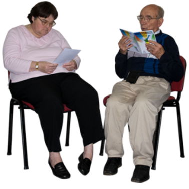 an older couple sitting together reading