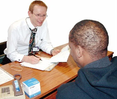 a man talking to his doctor at a GP appointment