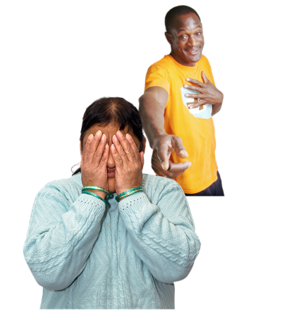 A woman hiding her face behind her hands while a man behind her points and laughs at her