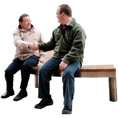 two men sitting on a bench and shaking hands