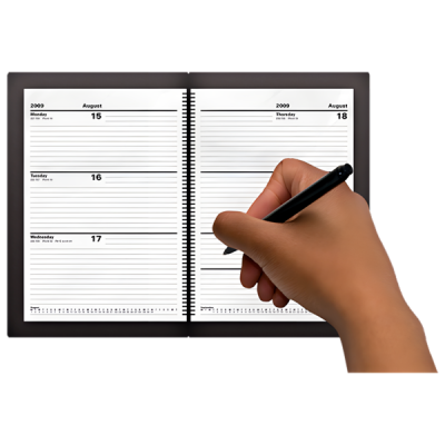 a hand holding a black pen writing in a diary