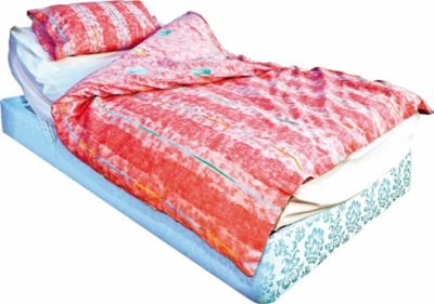 A bed with pillows and a duvet cover