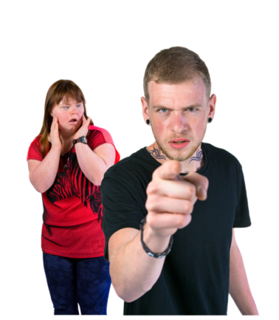 an angry man pointing with a frightened woman standing behind him