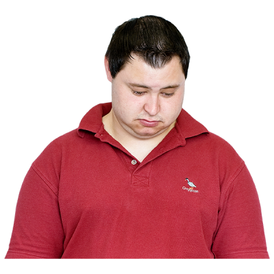 A sad man looking at the floor 