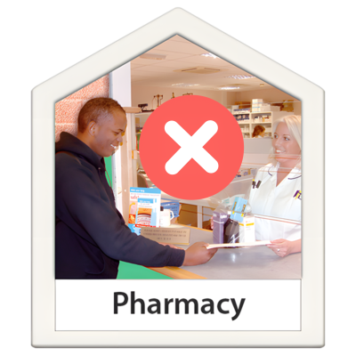 Pharmacy counter with tow people and a large red cross