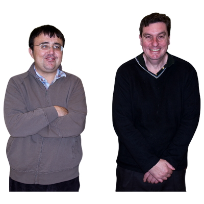 Two men standing together and smiling