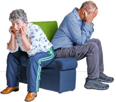 A man and woman sitting with their backs to each other, both with their head in their hands