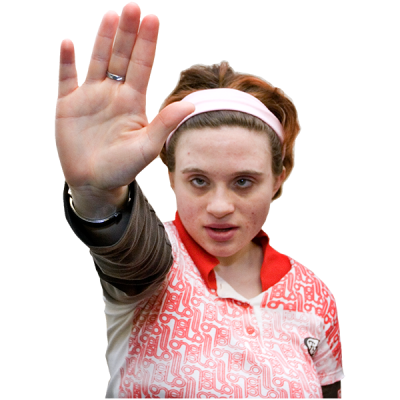 A young woman holding her arm up to say stop